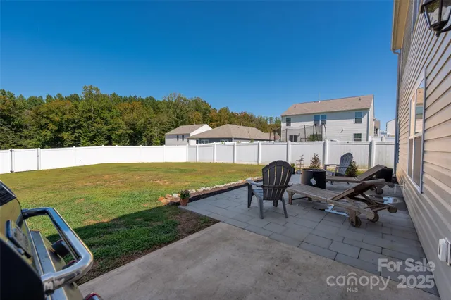 a swimming pool view with a outdoor seating