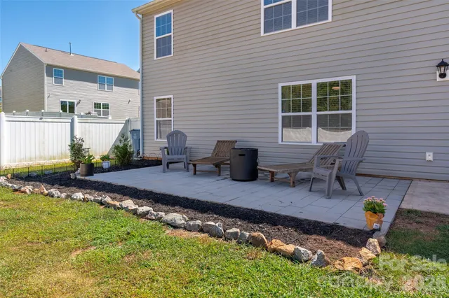 a swimming pool view with a outdoor seating