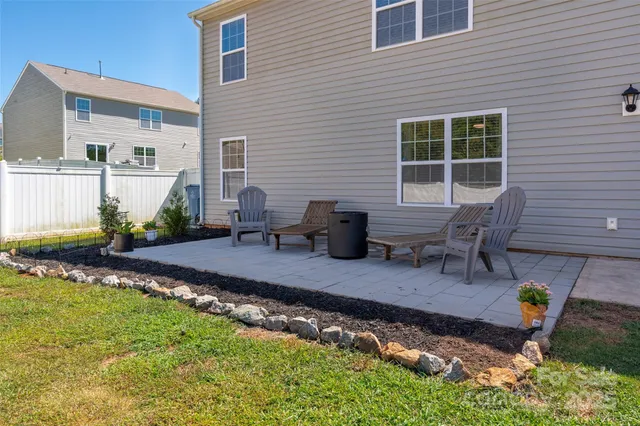 a front view of house with yard and seating space