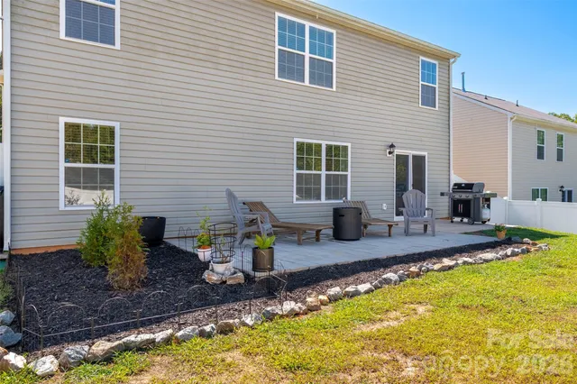 a front view of house with yard and seating space