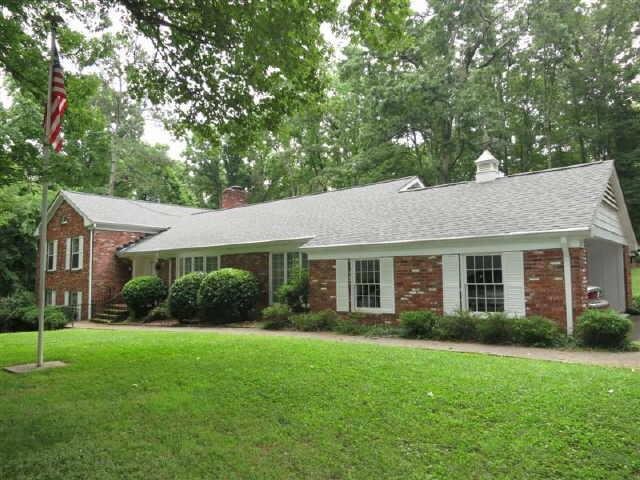 209 Green View Road Southwest Rome, GA 30165 - Photo 1 of 1 a view of a house that has a garden