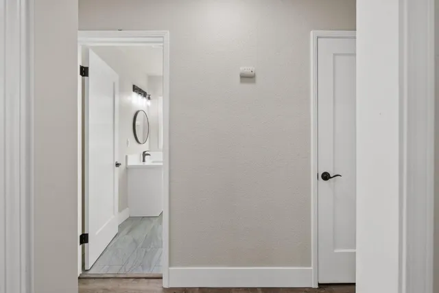 a bathroom with a granite countertop shower