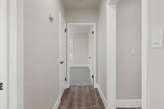 a view of a bathroom from a hallway