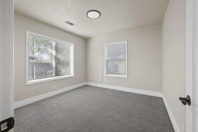 an empty room with windows