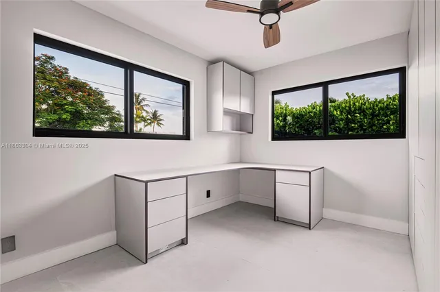 a view of workspace with furniture and window