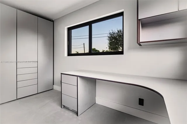 a view of a livingroom with furniture and a potted plant