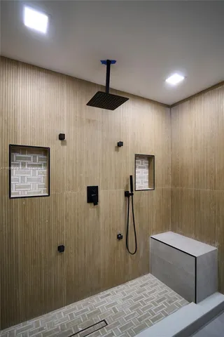 a bathroom with a toilet and a shower