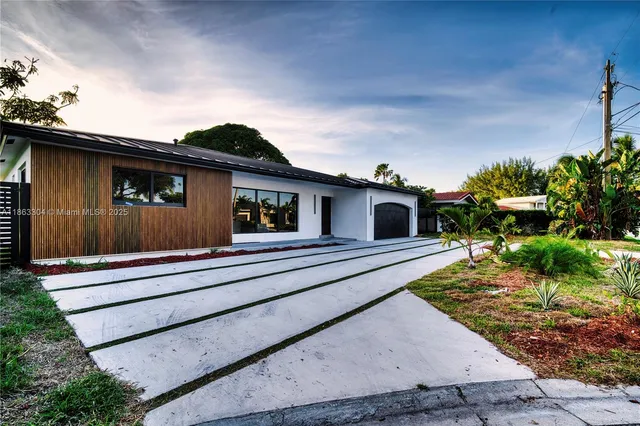 a house view with a garden space