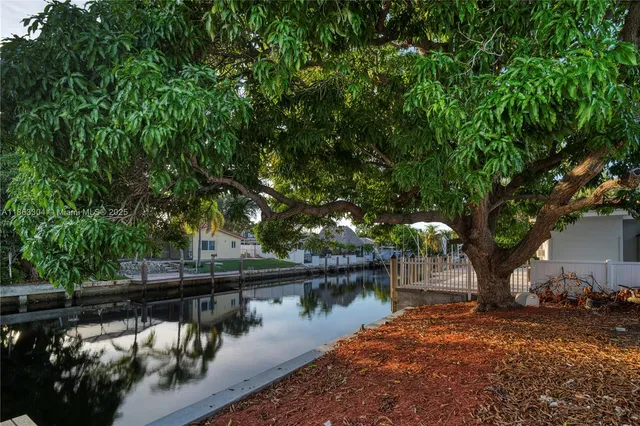 a house with river in front of it