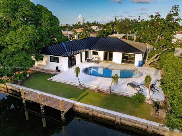 an aerial view of a house with a garden