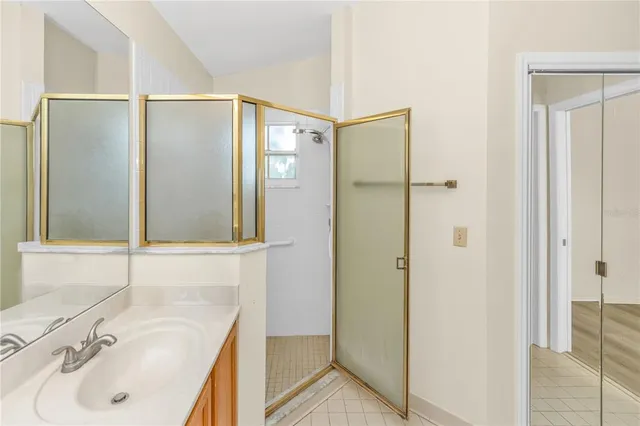 a bathroom with a sink and shower