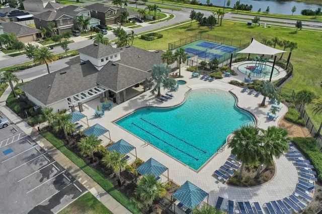 an aerial view of a house with outdoor space