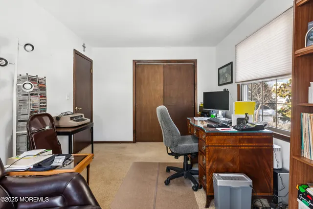 a view of a patio with iron fence