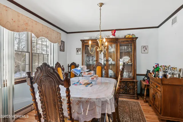 a view of a dining room with furniture window and outside view