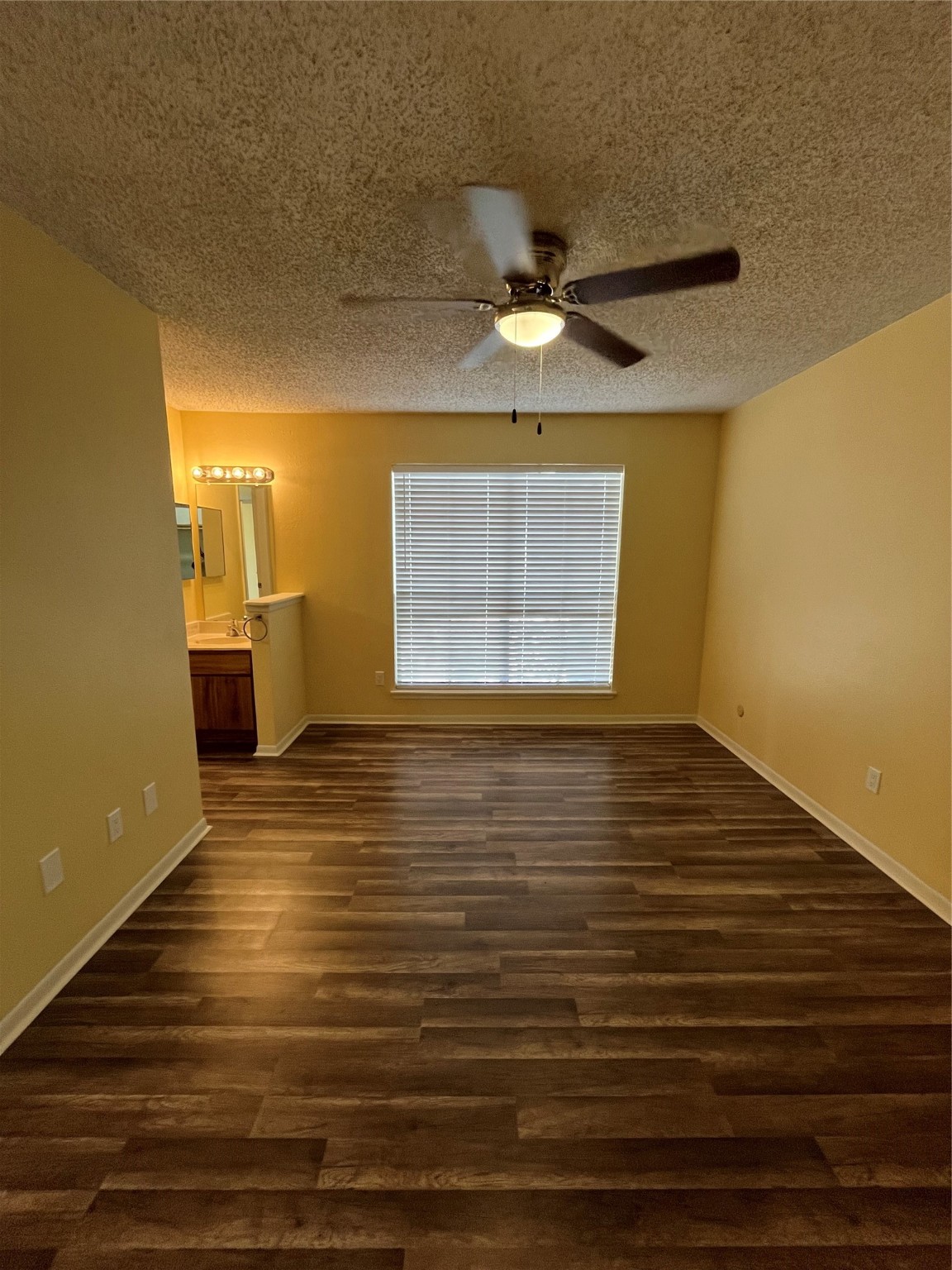 3919 Fairmont Parkway, Unit 200 Pasadena, TX 77504 - Photo 8 of 13 a view of an empty room with window and wooden floor