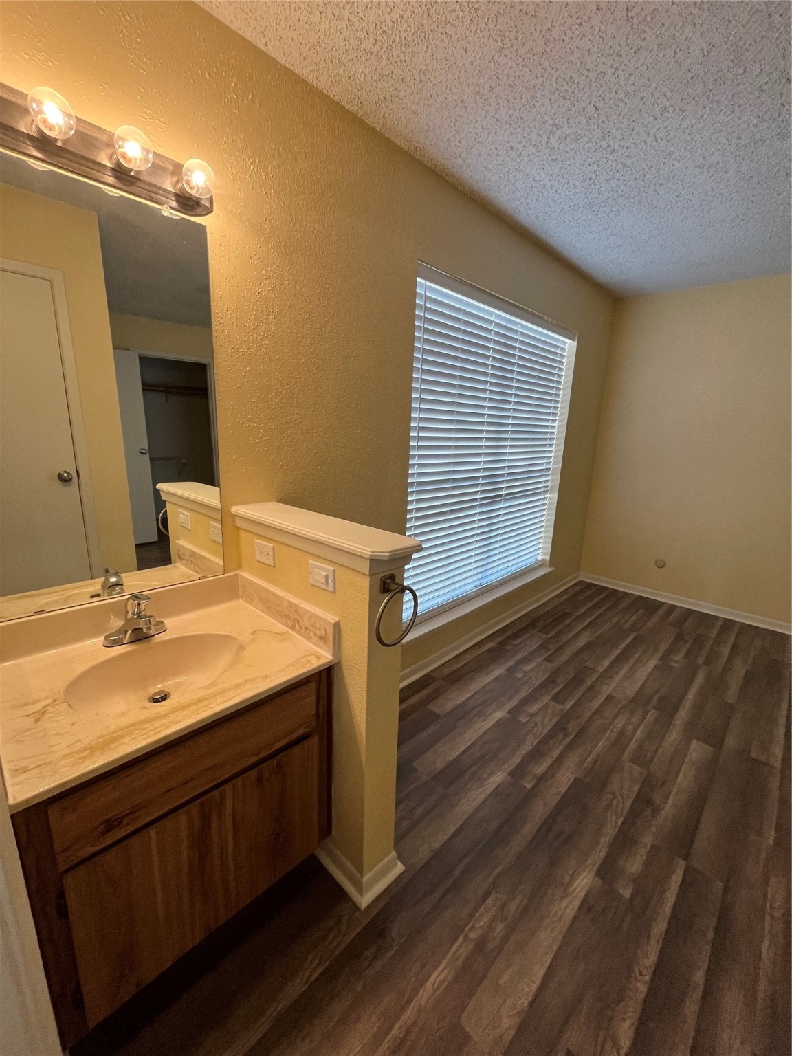 3919 Fairmont Parkway, Unit 200 Pasadena, TX 77504 - Photo 9 of 13 a bathroom with a sink and a mirror