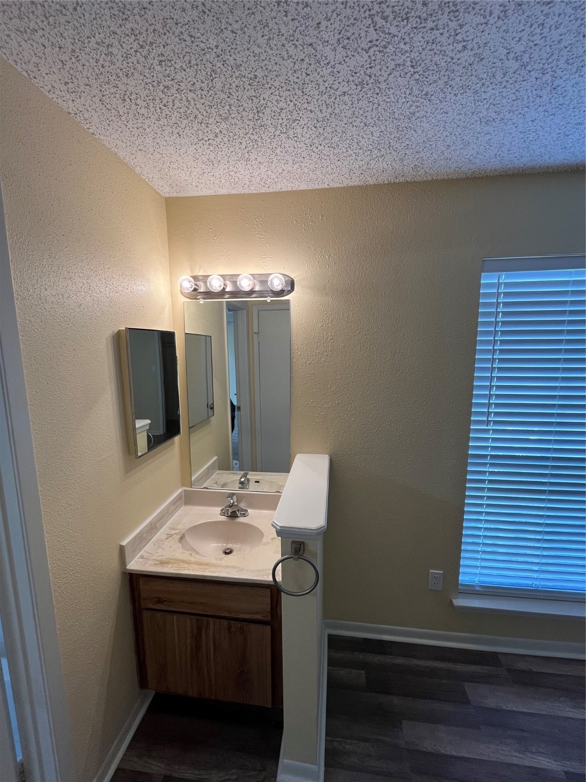 3919 Fairmont Parkway, Unit 200 Pasadena, TX 77504 - Photo 10 of 13 a bathroom with a sink and a mirror