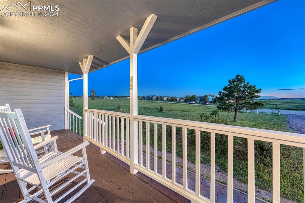 12220 Old Barn Road Elbert, CO 80106 - Photo 11 of 47 a view of a chair and table in the balcony