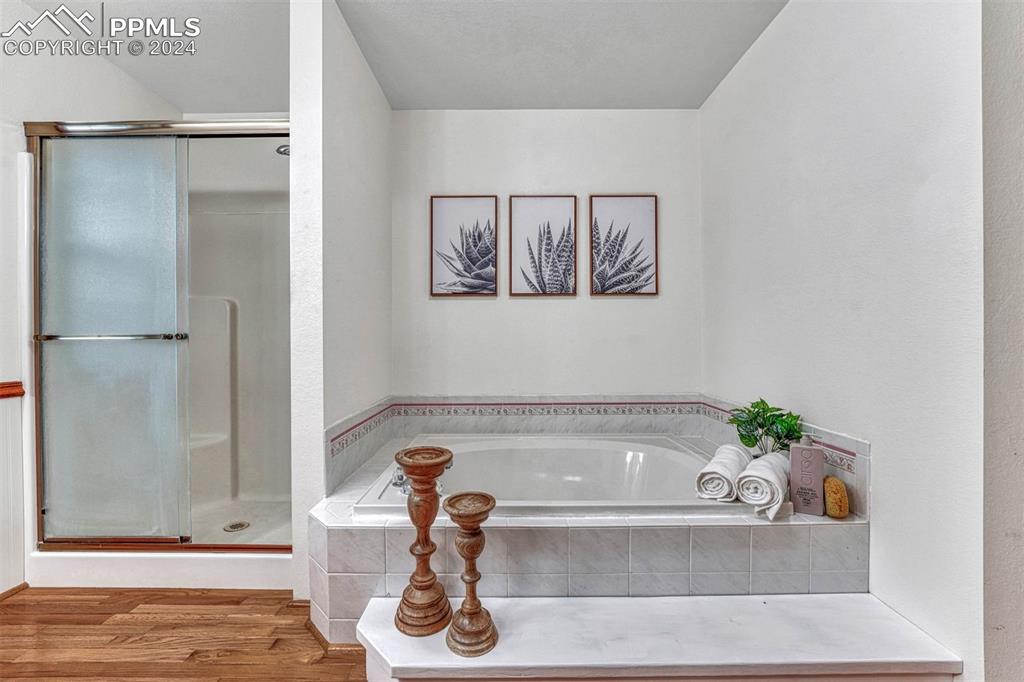 12220 Old Barn Road Elbert, CO 80106 - Photo 20 of 47 a bathroom with a tub and shower