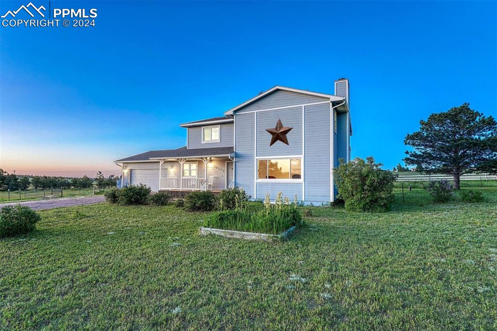 12220 Old Barn Road Elbert, CO 80106 - Photo 21 of 47 a front view of a house with a yard