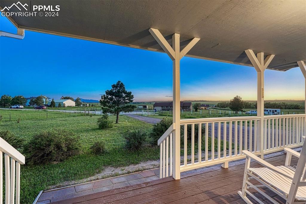 12220 Old Barn Road Elbert, CO 80106 - Photo 22 of 47 a view of a chairs and table in the back yard
