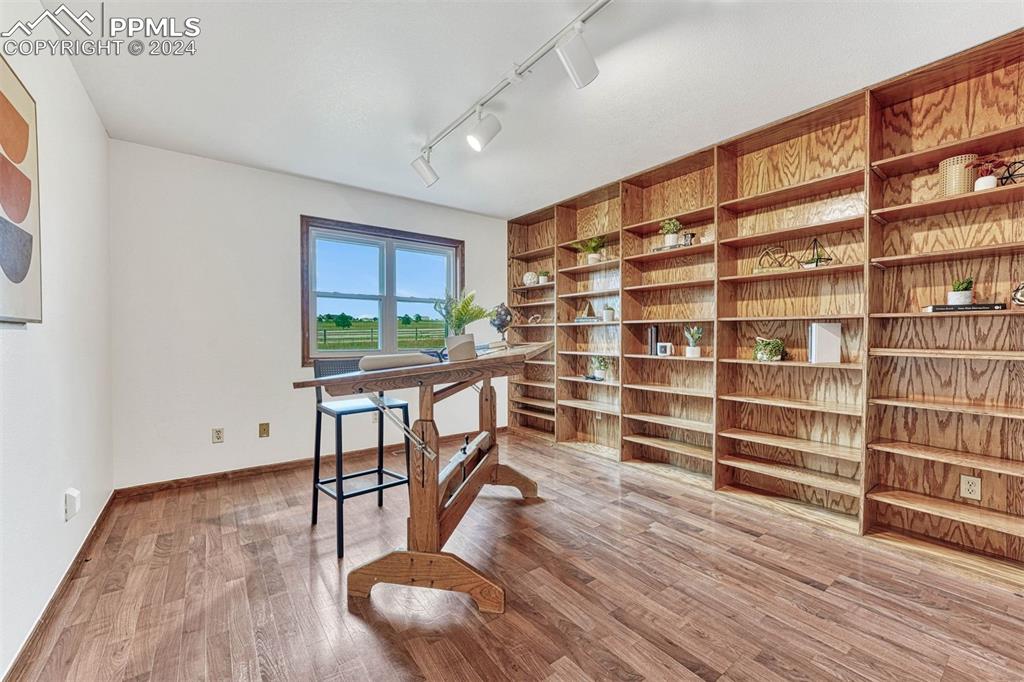 12220 Old Barn Road Elbert, CO 80106 - Photo 25 of 47 a living room with furniture and a wooden floor