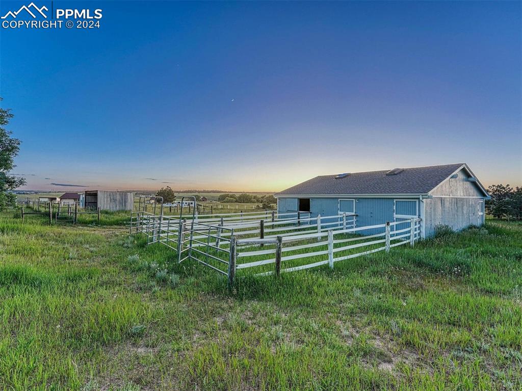 12220 Old Barn Road Elbert, CO 80106 - Photo 36 of 47 a view of a house with a yard