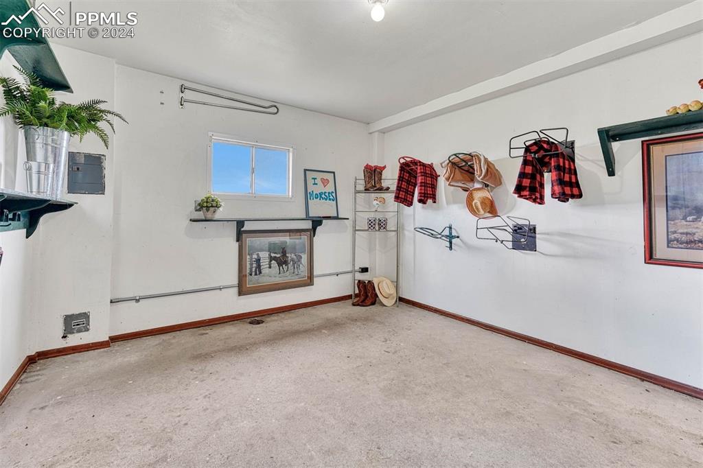 12220 Old Barn Road Elbert, CO 80106 - Photo 38 of 47 a view of kitchen with cabinets and flat screen tv