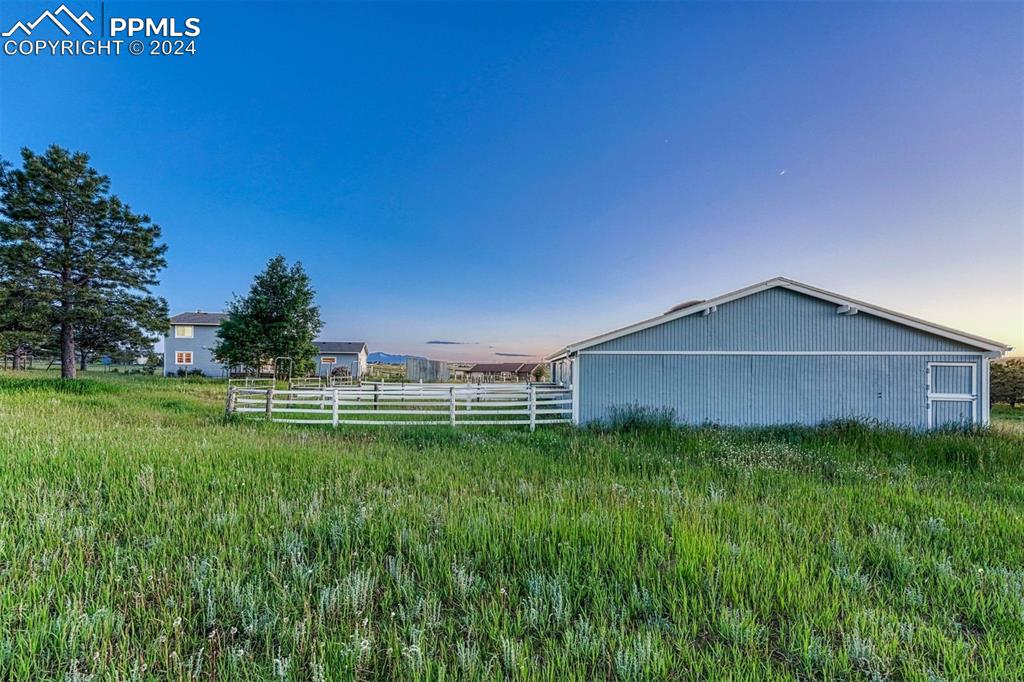 12220 Old Barn Road Elbert, CO 80106 - Photo 46 of 47 a backyard of a house with lots of green space