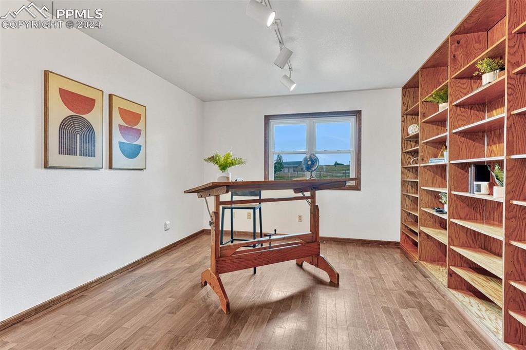 12220 Old Barn Road Elbert, CO 80106 - Photo 5 of 47 a living room with furniture and a wooden floor