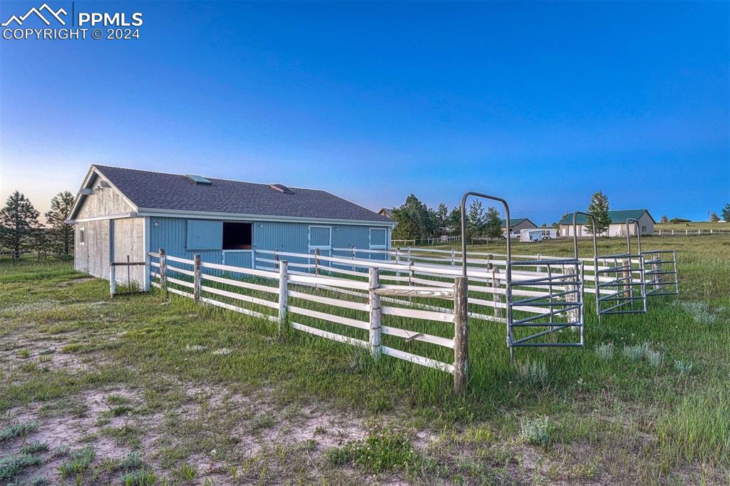 12220 Old Barn Road Elbert, CO 80106 - Photo 8 of 47 a view of a house with a yard