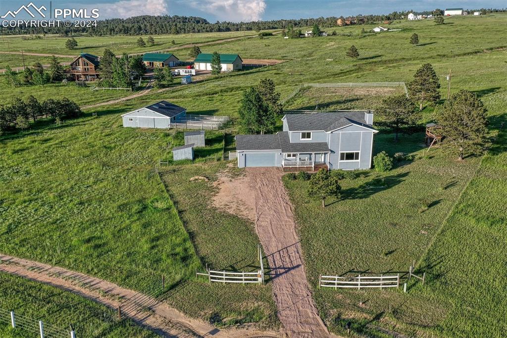 12220 Old Barn Road Elbert, CO 80106 - Photo 10 of 47 an aerial view of a house with a yard lake view and mountain view in back