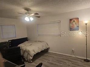a bedroom with a bed and a desk