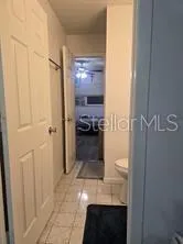 a bathroom with a sink toilet and mirror