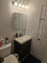 a bathroom with a sink and mirror
