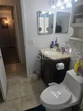 a bathroom with a sink a toilet and a bathtub
