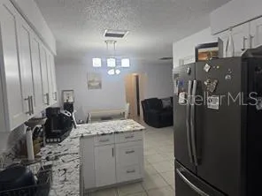 a kitchen with a stove and a refrigerator