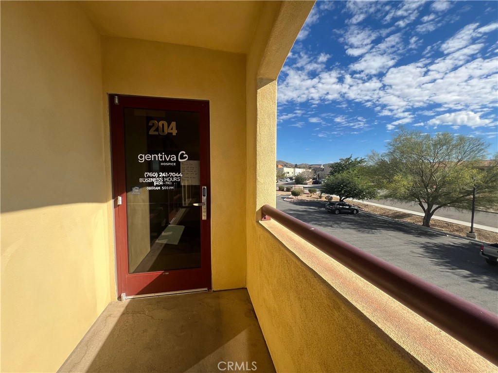 16070 Tuscola Road, Unit 204 Apple Valley, CA 92307 - Photo 3 of 10 a view of swimming pool from a balcony