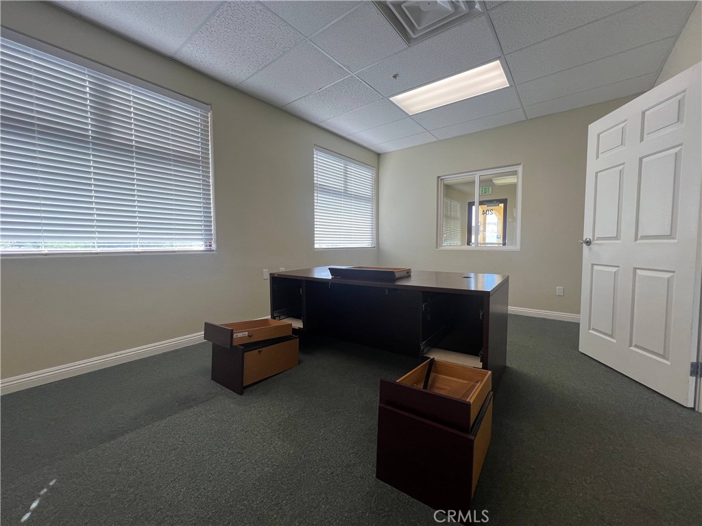 16070 Tuscola Road, Unit 204 Apple Valley, CA 92307 - Photo 6 of 10 a living room with furniture and a window