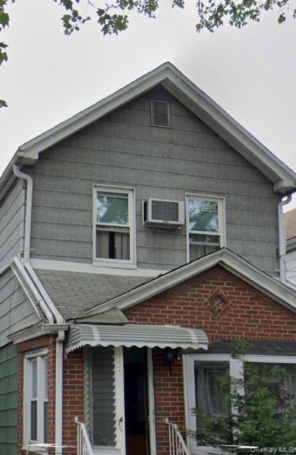 91-33 78th Street Queens, NY 11421 - Photo 2 of 26 a front view of a house with windows
