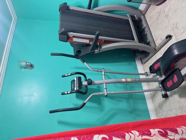 91-33 78th Street Queens, NY 11421 - Photo 25 of 26 a view of a room with gym equipment