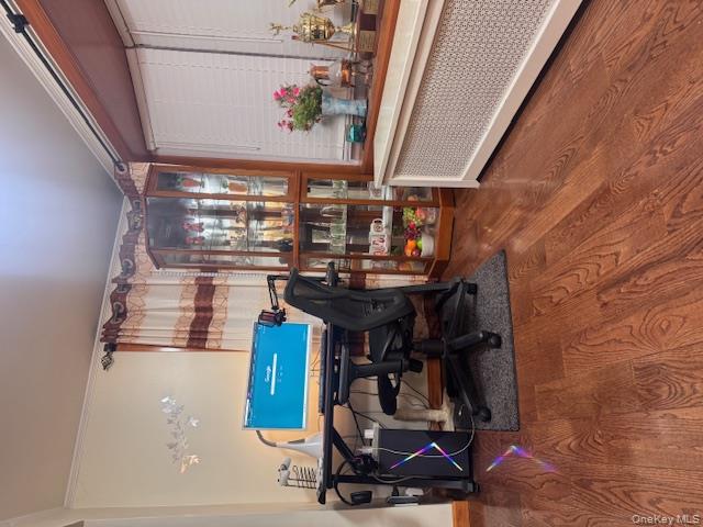 91-33 78th Street Queens, NY 11421 - Photo 3 of 26 a living room with furniture a rug and a potted plant