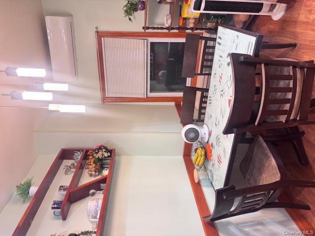 91-33 78th Street Queens, NY 11421 - Photo 8 of 26 a view of a dining room with furniture and wooden floor