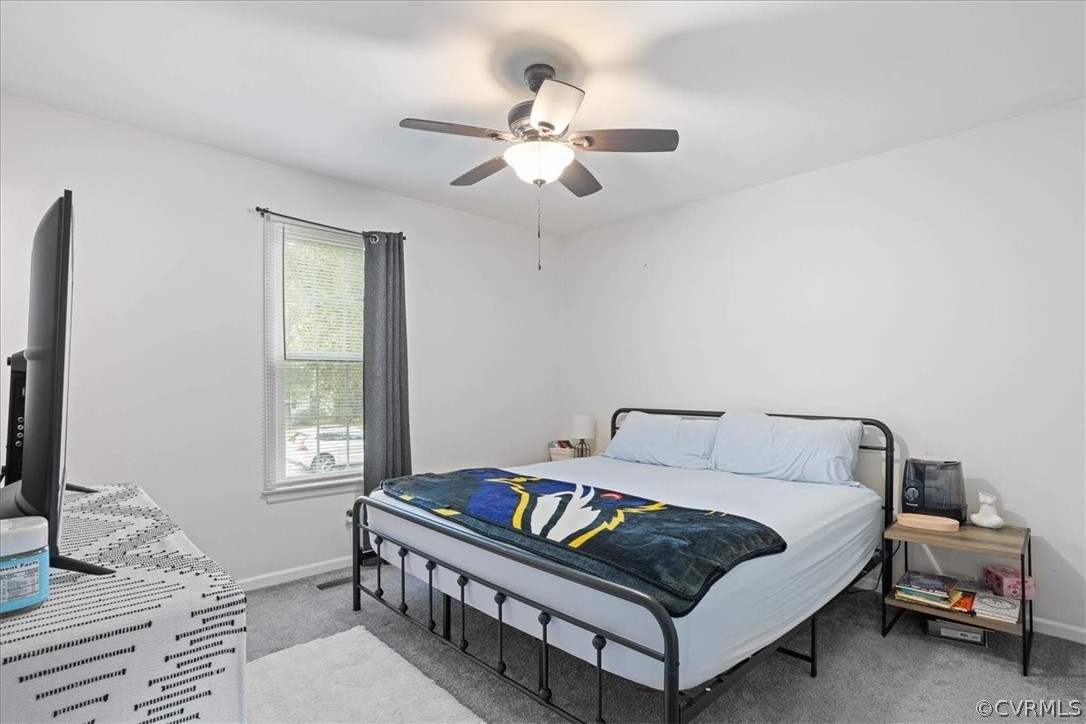 16127 Sandwave Road Chester, VA 23831 - Photo 16 of 26 a bedroom with a bed and a window