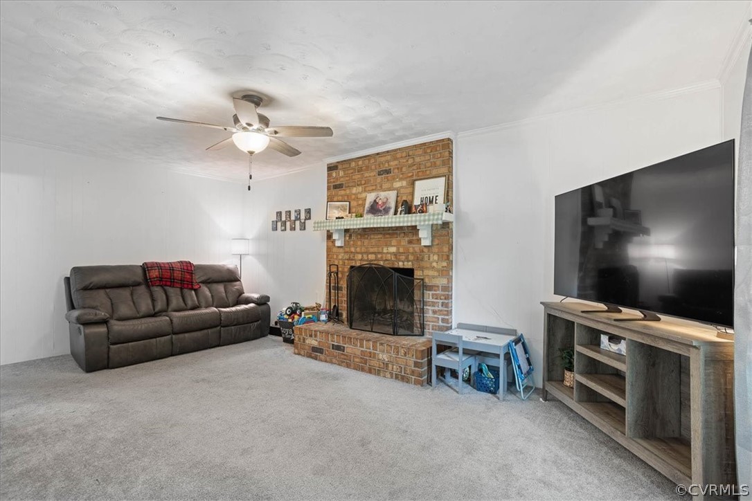 16127 Sandwave Road Chester, VA 23831 - Photo 8 of 26 a living room with furniture and a flat screen tv