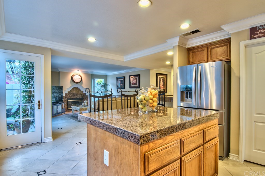 4224 San Ramon Drive Corona, CA 92882 - Photo 11 of 63 Partial views of the kitchen and the family room from the kitchen area.