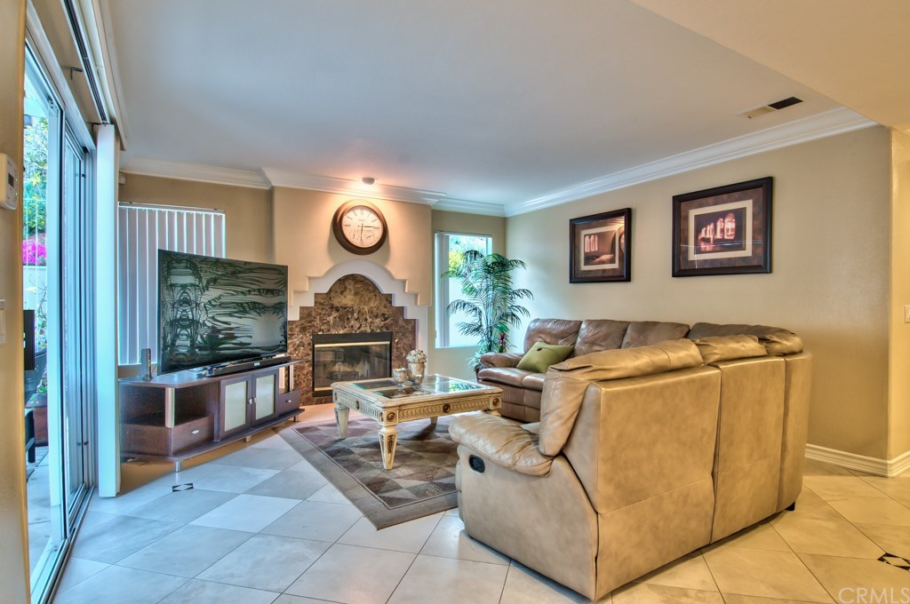 4224 San Ramon Drive Corona, CA 92882 - Photo 14 of 63 The spacious family room has a full bar and a natural gas marble fireplace.