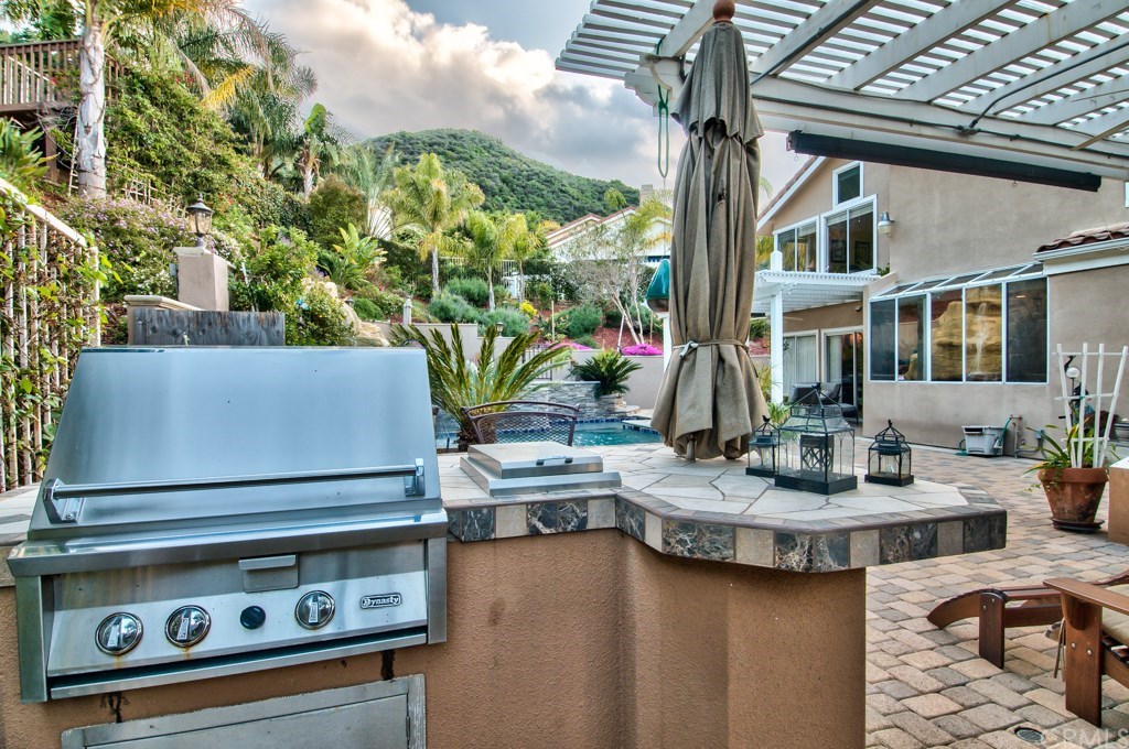 4224 San Ramon Drive Corona, CA 92882 - Photo 24 of 63 This backyard also has an outdoor barbecue.