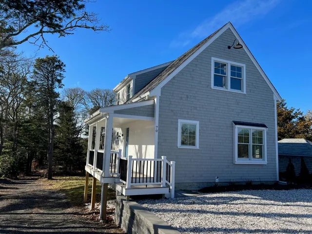 a front view of a house with stairs