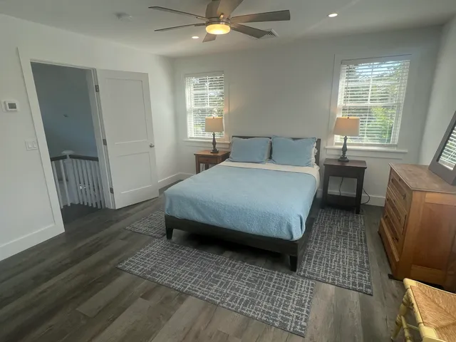 a bedroom with a bed and window